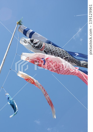 Carp streamer swimming in the blue sky Carp streamer swimming in the blue sky 139129961