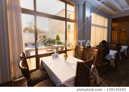 A bright hotel restaurant in the morning A bright hotel restaurant in the morning 139130585