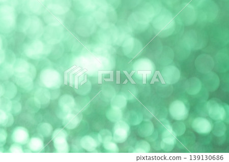 A green background with a circular bokeh effect. A green background with a circular bokeh effect. 139130686
