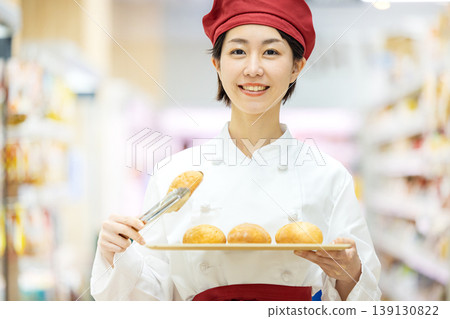 Woman working in a bakery Woman working in a bakery 139130822