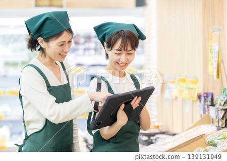 Female employee in charge of inventory management at a supermarket Female employee in charge of inventory management at a supermarket 139131949