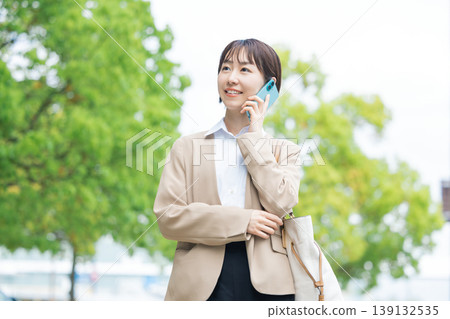 Business: Portrait of a woman walking outdoors 139132535