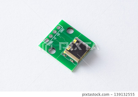 USB Type-C power connector module on green circuit board isolated on white background 139132555