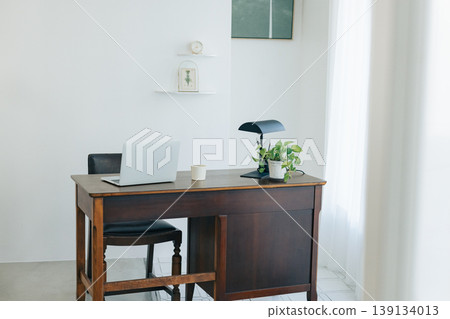Study room; desk where a laptop is placed. 139134013