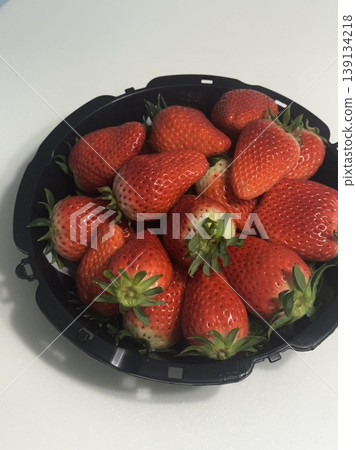 Fresh, juicy strawberries with a vibrant red color and sweet, slightly tangy flavor. Perfect for snacking, adding to desserts, smoothies, or salads, they bring a burst of natural sweetness to any dish 139134218
