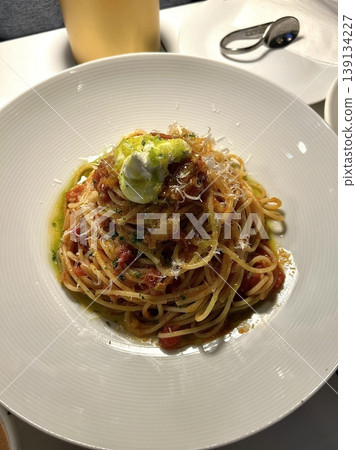 A plate of spaghetti pasta, perfectly cooked and topped with rich marinara sauce and fresh herbs. Ideal for food photography and menus, capturing the heart of Italian cuisine in a delicious way. A plate of spaghetti pasta, perfectly cooked and topped with rich marinara sauce and fresh herbs. Ideal for food photography and menus, capturing the heart of Italian cuisine in a delicious way. 139134227