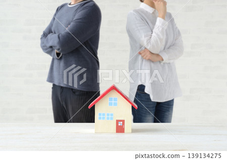 A couple who are worried or unsure about buying or building their own home. 139134275
