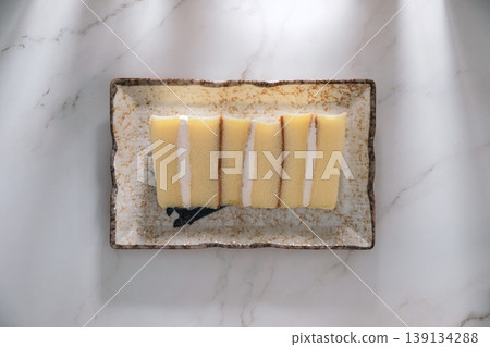 Top table view of Sponge cake on marble background. Top table view of Sponge cake on marble background. 139134288