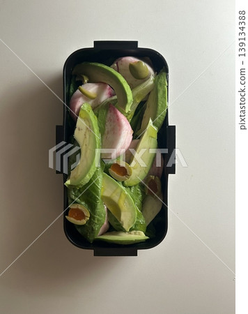 Bento or dosirak box filled with rice, assorted side dishes, vegetables, and protein like meat or fish, all neatly arranged to create a balanced, colorful, and visually appealing meal Bento or dosirak box filled with rice, assorted side dishes, vegetables, and protein like meat or fish, all neatly arranged to create a balanced, colorful, and visually appealing meal 139134388