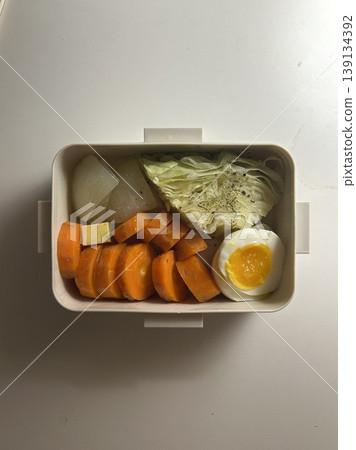 Bento or dosirak box filled with rice, assorted side dishes, vegetables, and protein like meat or fish, all neatly arranged to create a balanced, colorful, and visually appealing meal Bento or dosirak box filled with rice, assorted side dishes, vegetables, and protein like meat or fish, all neatly arranged to create a balanced, colorful, and visually appealing meal 139134392