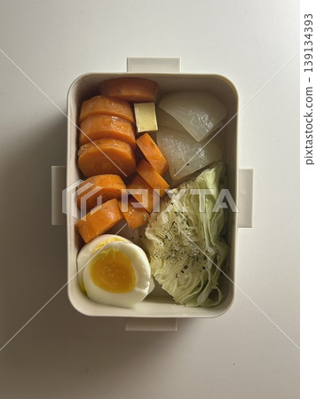 Bento or dosirak box filled with rice, assorted side dishes, vegetables, and protein like meat or fish, all neatly arranged to create a balanced, colorful, and visually appealing meal Bento or dosirak box filled with rice, assorted side dishes, vegetables, and protein like meat or fish, all neatly arranged to create a balanced, colorful, and visually appealing meal 139134393