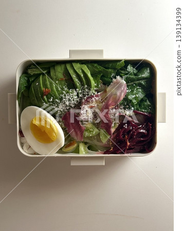 Bento or dosirak box filled with rice, assorted side dishes, vegetables, and protein like meat or fish, all neatly arranged to create a balanced, colorful, and visually appealing meal Bento or dosirak box filled with rice, assorted side dishes, vegetables, and protein like meat or fish, all neatly arranged to create a balanced, colorful, and visually appealing meal 139134399