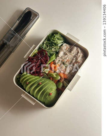 Bento or dosirak box filled with rice, assorted side dishes, vegetables, and protein like meat or fish, all neatly arranged to create a balanced, colorful, and visually appealing meal Bento or dosirak box filled with rice, assorted side dishes, vegetables, and protein like meat or fish, all neatly arranged to create a balanced, colorful, and visually appealing meal 139134406