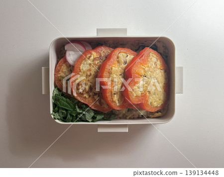 Bento or dosirak box filled with rice, assorted side dishes, vegetables, and protein like meat or fish, all neatly arranged to create a balanced, colorful, and visually appealing meal Bento or dosirak box filled with rice, assorted side dishes, vegetables, and protein like meat or fish, all neatly arranged to create a balanced, colorful, and visually appealing meal 139134448