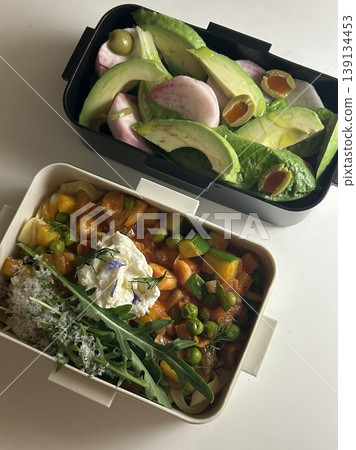 Bento or dosirak box filled with rice, assorted side dishes, vegetables, and protein like meat or fish, all neatly arranged to create a balanced, colorful, and visually appealing meal Bento or dosirak box filled with rice, assorted side dishes, vegetables, and protein like meat or fish, all neatly arranged to create a balanced, colorful, and visually appealing meal 139134453