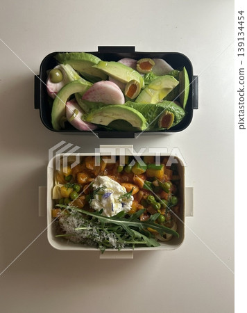 Bento or dosirak box filled with rice, assorted side dishes, vegetables, and protein like meat or fish, all neatly arranged to create a balanced, colorful, and visually appealing meal Bento or dosirak box filled with rice, assorted side dishes, vegetables, and protein like meat or fish, all neatly arranged to create a balanced, colorful, and visually appealing meal 139134454