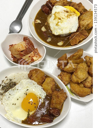 A comforting bowl of Japanese curry, featuring a rich, savory sauce with tender vegetables and chunks of meat, served over fluffy rice. A warm, flavorful dish perfect for any meal. A comforting bowl of Japanese curry, featuring a rich, savory sauce with tender vegetables and chunks of meat, served over fluffy rice. A warm, flavorful dish perfect for any meal. 139134573