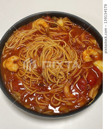 Classic spaghetti coated in rich tomato sauce, offering a simple yet delicious combination of tangy, savory flavors perfect for a comforting meal. Classic spaghetti coated in rich tomato sauce, offering a simple yet delicious combination of tangy, savory flavors perfect for a comforting meal. 139134579