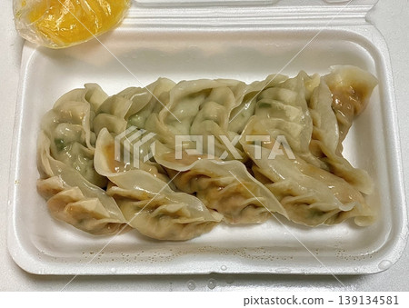 Korean dumplings filled with a mix of savory ingredients like ground meat, tofu, and vegetables. Mandu can be steamed, boiled, or pan-fried, making it a versatile and delicious snack or meal. Korean dumplings filled with a mix of savory ingredients like ground meat, tofu, and vegetables. Mandu can be steamed, boiled, or pan-fried, making it a versatile and delicious snack or meal. 139134581