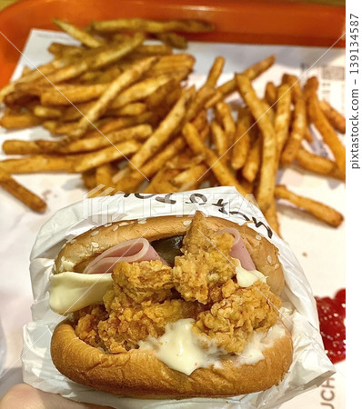 A classic combination of a juicy burger with fresh toppings served alongside golden, crispy French fries. Perfect for a satisfying meal that blends savory flavors and crunchy textures. A classic combination of a juicy burger with fresh toppings served alongside golden, crispy French fries. Perfect for a satisfying meal that blends savory flavors and crunchy textures. 139134587
