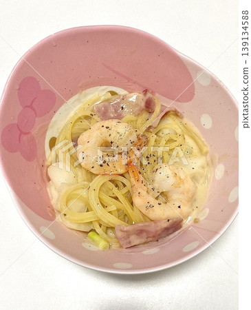 Creamy and rich spaghetti coated in a luscious white sauce, offering a smooth and savory flavor perfect for a comforting and satisfying meal. Creamy and rich spaghetti coated in a luscious white sauce, offering a smooth and savory flavor perfect for a comforting and satisfying meal. 139134588