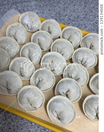 Korean dumplings filled with a mix of savory ingredients like ground meat, tofu, and vegetables. Mandu can be steamed, boiled, or pan-fried, making it a versatile and delicious snack or meal. Korean dumplings filled with a mix of savory ingredients like ground meat, tofu, and vegetables. Mandu can be steamed, boiled, or pan-fried, making it a versatile and delicious snack or meal. 139134608