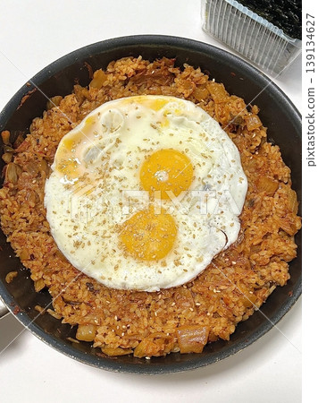 Bokkeumbap, a Korean fried rice dish, often made with kimchi or other vegetables, meats, and seasoned with savory spices. A comforting and flavorful meal! Bokkeumbap, a Korean fried rice dish, often made with kimchi or other vegetables, meats, and seasoned with savory spices. A comforting and flavorful meal! 139134627