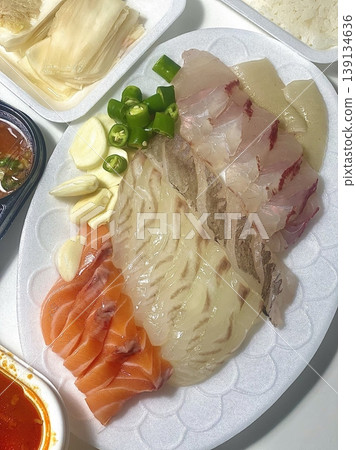Fresh and delicate sashimi slices, beautifully presented with vibrant colors and perfect cuts. This traditional Japanese delicacy highlights the pure flavors of premium seafood. Fresh and delicate sashimi slices, beautifully presented with vibrant colors and perfect cuts. This traditional Japanese delicacy highlights the pure flavors of premium seafood. 139134636