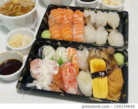 An assortment of fresh sushi, artfully arranged with a variety of toppings and vibrant colors. This traditional Japanese dish combines vinegared rice, seafood, and vegetables for an experience. An assortment of fresh sushi, artfully arranged with a variety of toppings and vibrant colors. This traditional Japanese dish combines vinegared rice, seafood, and vegetables for an experience. 139134648