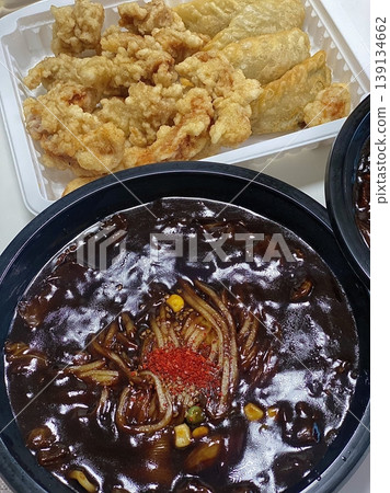 A classic Korean-Chinese combo of jajangmyeon with thick, chewy noodles coated in rich black bean sauce, served alongside crispy tangsuyuk, deep-fried pork with sweet and sour sauce. A classic Korean-Chinese combo of jajangmyeon with thick, chewy noodles coated in rich black bean sauce, served alongside crispy tangsuyuk, deep-fried pork with sweet and sour sauce. 139134662