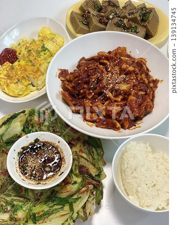 Warm and comforting jibbap (home-cooked Korean meal) with a spread of rice, soup, and banchan, offering a perfect harmony of flavor, tradition, and heartwarming nourishment in every bite. Warm and comforting jibbap (home-cooked Korean meal) with a spread of rice, soup, and banchan, offering a perfect harmony of flavor, tradition, and heartwarming nourishment in every bite. 139134745