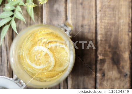 Homemade lemon syrup made in a sealed jar Homemade lemon syrup made in a sealed jar 139134849
