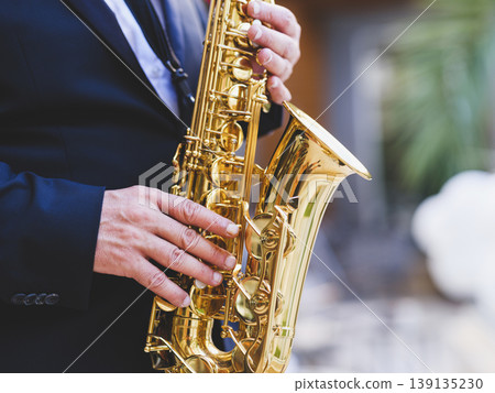 a man playing the saxophone 139135230