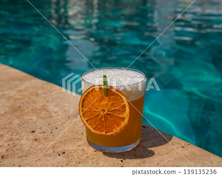 delicious cocktail by the pool delicious cocktail by the pool 139135236