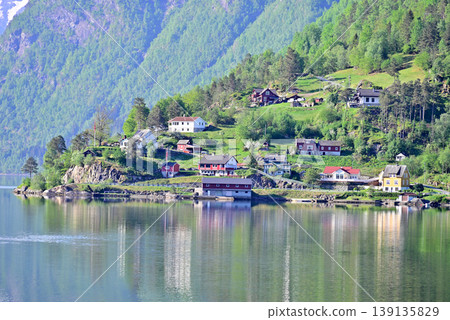 The houses of Ulvik scattered along the banks of Ulvikfjord The houses of Ulvik scattered along the banks of Ulvikfjord 139135829