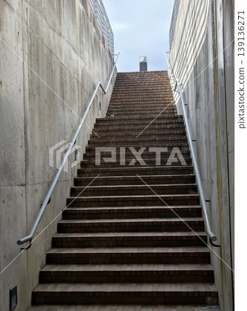 Staircase surrounded by a concrete wall Staircase surrounded by a concrete wall 139136271