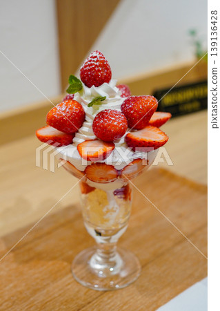 A gourmet strawberry parfait topped with fresh berries. 139136428