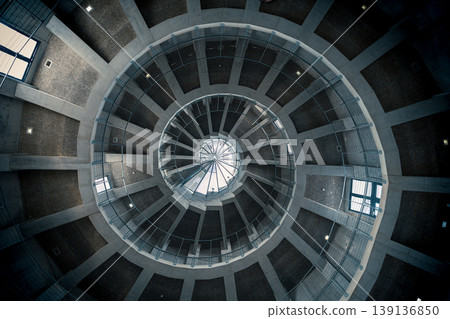 Looking up at the geometric spiral staircase Looking up at the geometric spiral staircase 139136850