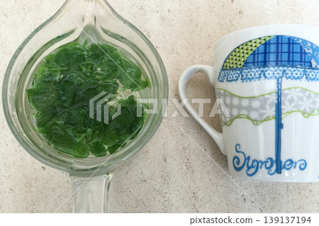 Fresh herbal tea and mug Fresh herbal tea and mug 139137194