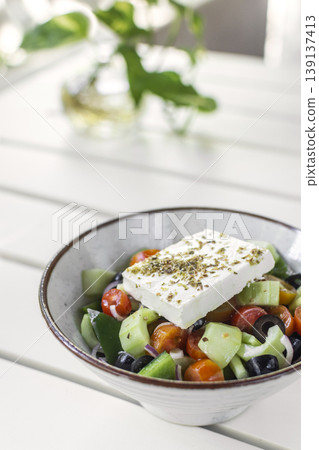 traditional greek feta cheese salad on white table at outdoor cafe in greece traditional greek feta cheese salad on white table at outdoor cafe in greece 139137413
