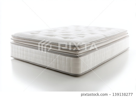 Mattress against white background. Memory foam mattress. Close up white orthopedic mattress corner, copy space for text. Hypoallergenic bed base for proper spinal alignment and pressure point relief. Mattress against white background. Memory foam mattress. Close up white orthopedic mattress corner, copy space for text. Hypoallergenic bed base for proper spinal alignment and pressure point relief. 139138277