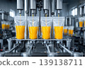 Industrial juice filling line automation sterile. Clear plastic bottles travel on conveyor under precision nozzles. Vibrant orange liquid flows into containers. Modern juice bottling sealing equipment 139138711