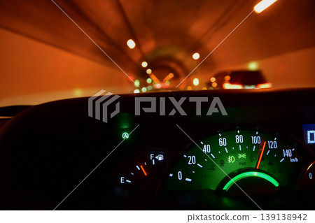 View from inside a car traveling through a tunnel View from inside a car traveling through a tunnel 139138942