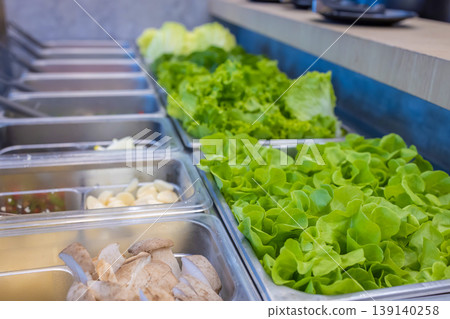Salad bar with vegetables in the restaurant, healthy food.  139140258