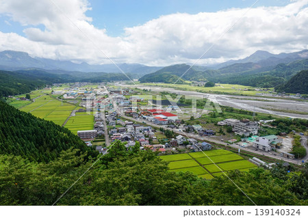 A rural landscape with mountains, rivers, and rice paddies. A rural landscape with mountains, rivers, and rice paddies. 139140324