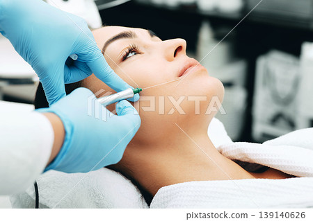 woman having facial injections for facelift and anti-aging effect. Lip wrinkle removal woman having facial injections for facelift and anti-aging effect. Lip wrinkle removal 139140626