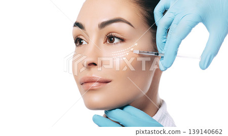 Advertising botulinum toxin injections in the face. Arrows show skin rejuvenation effect, macro 139140662