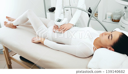 Cellulite removal procedure on the stomach for a beautiful woman. Lpg massage at the spa 139140682