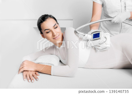 Beautiful woman receiving lpg massage against cellulite 139140735