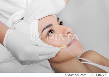 woman having facial injections for facelift and anti-aging effect woman having facial injections for facelift and anti-aging effect 139140774